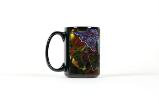Left side view of black mug with dark autum leavs with frost coateded edges
