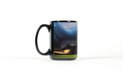 Left side view of black mug with a supercell over a farmfield